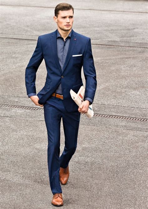 navy suit tan shoes